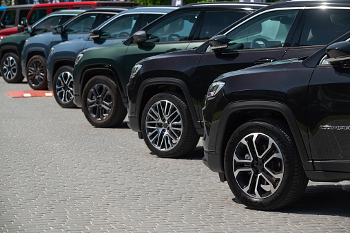 Berlin, Germany - 28th June, 2021: Jeep Compass SUV cars on a public parking. These vehicles are popular SUV cars on the European market.
