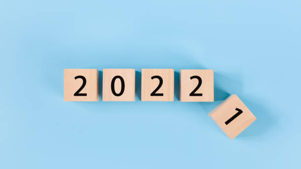 istock woodblocks cubes with a number 2021 change to 2022 blue background. 1357200626