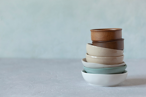 small bowls on the light green background, rustic style, selective focus