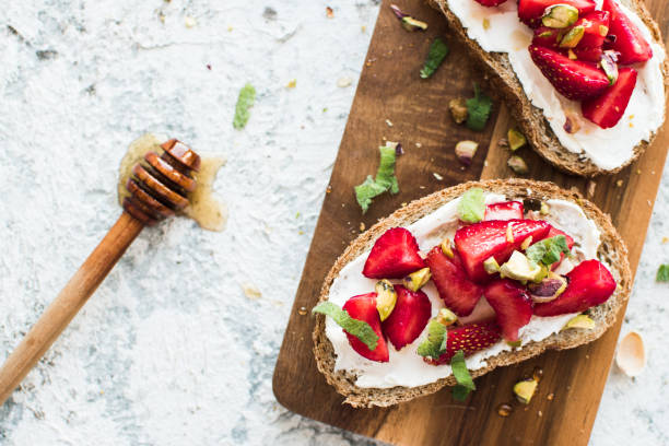 istock Sandwich with strawberries, soft cheese and honey 1357204600