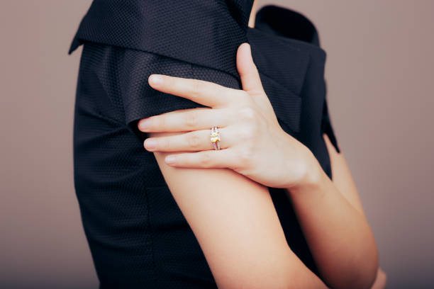 hand model wearing a yellow gemstone ring piece of jewelry - hand gold jewels bildbanksfoton och bilder