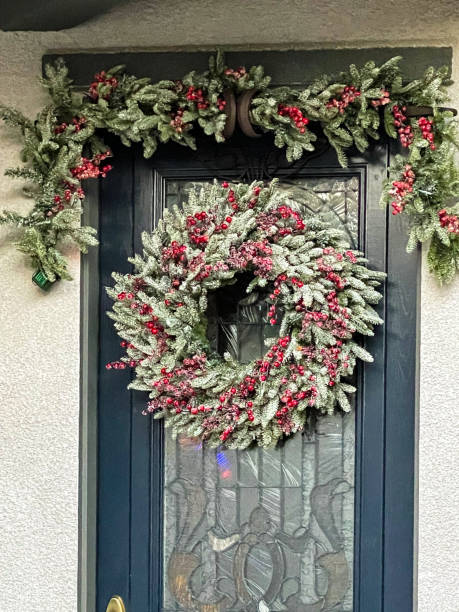 istock Home Front Door Decorated For Christmas 1357210219
