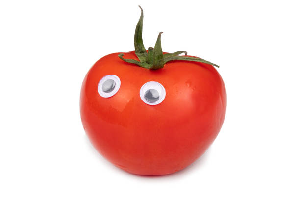 istock red tomato with eyes isolated, tomato face on white background 1357210981