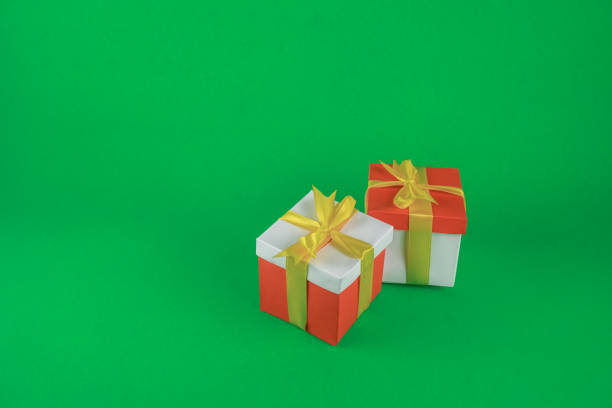 istock Two red white gift box packages with gold ribbon 1357218740