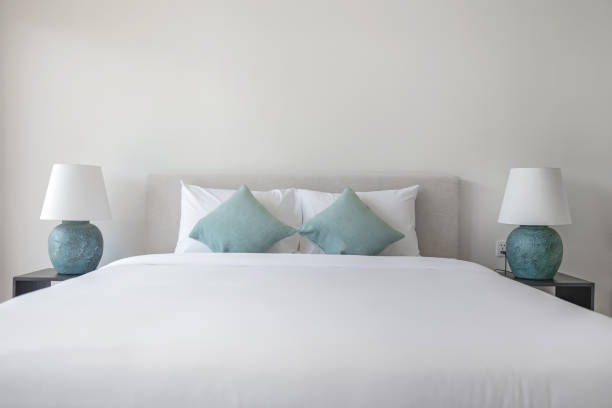 Shot of clean pillows neatly arranged on a double bed.
