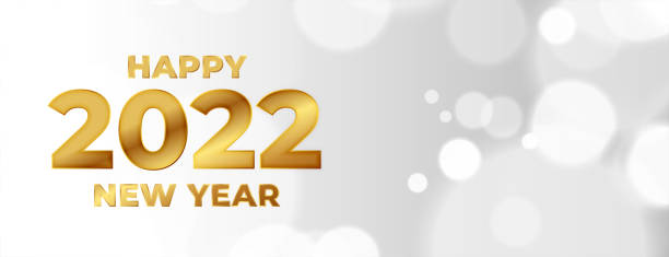istock happy new year 2022 golden text bokeh banner design 1357224262