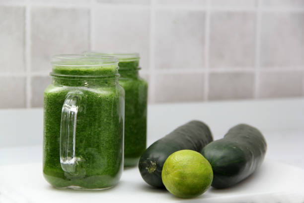 istock Green juice made from vegetables such as cucumber, lemon, spinach, chard, celery served in a glass mason jar for a healthy, vegan and nutritious breakfast 1357224843