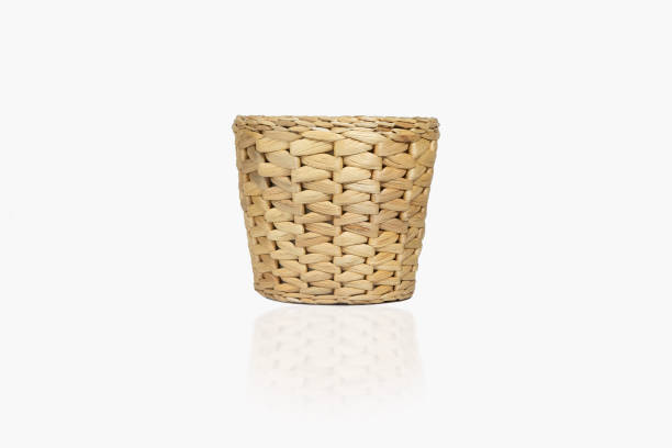 Vintage wicker eco flower pot, basket isolated on white background, with reflection and shadow. Rustic flower pot loft for home decoration