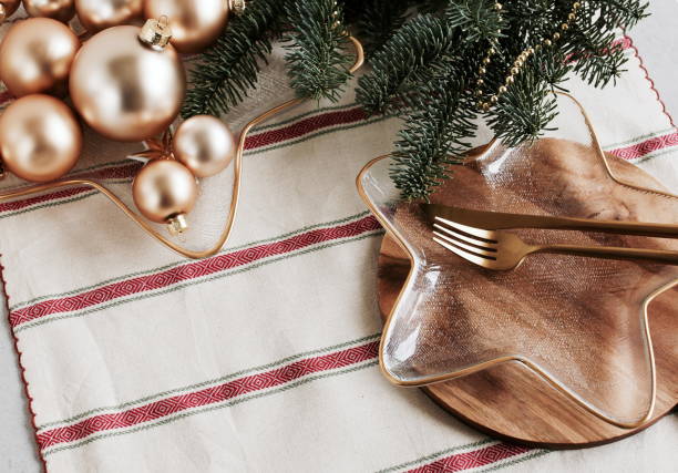 istock Christmas table setting with golden cutlery and decorations top view on  linen tablecloth , copy space. 1357228017