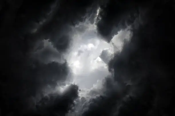 Hole in the Dark and Dramatic Storm Clouds