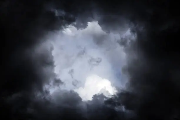 Hole in the Dark and Dramatic Storm Clouds