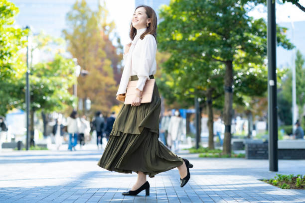 istock woman commuting in office casual style 1357229785