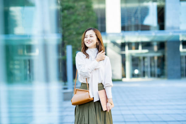 istock woman commuting in office casual style 1357229798