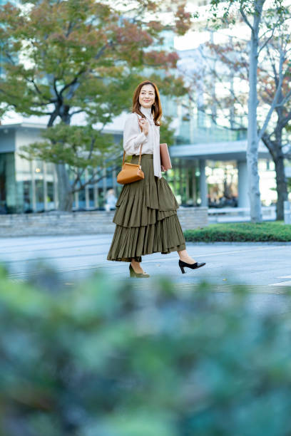 istock woman commuting in office casual style 1357230002