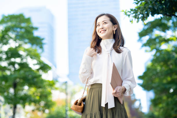 istock woman commuting in office casual style 1357230524