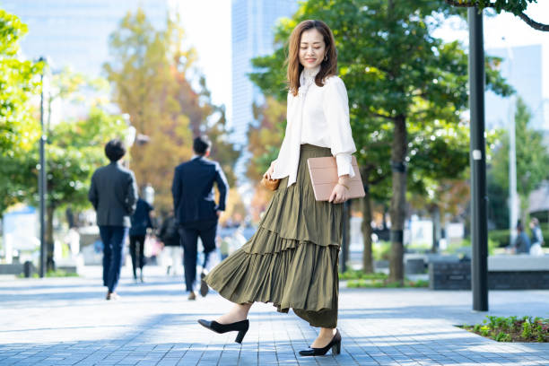 istock woman commuting in office casual style 1357230698