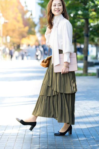 istock woman commuting in office casual style 1357230717