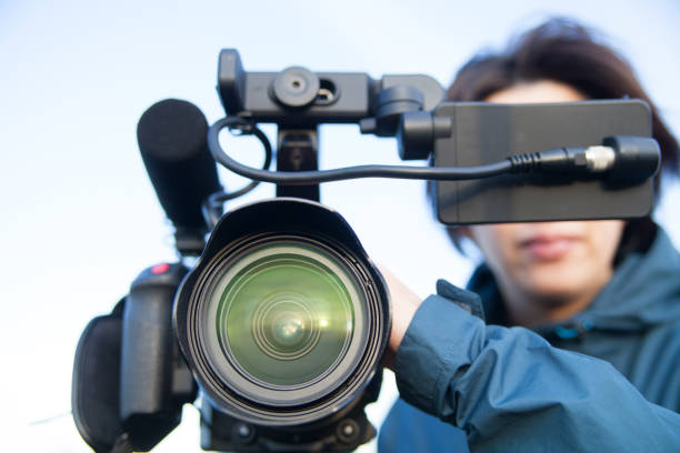 istock woman filming with 4k camcorder 1357231071