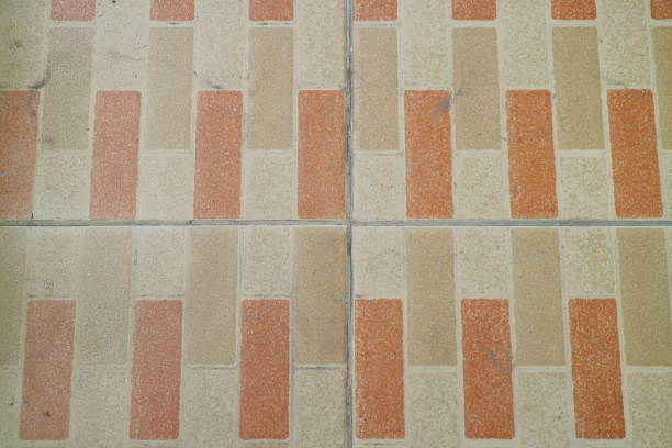 Puddles after rain on decorative tiles