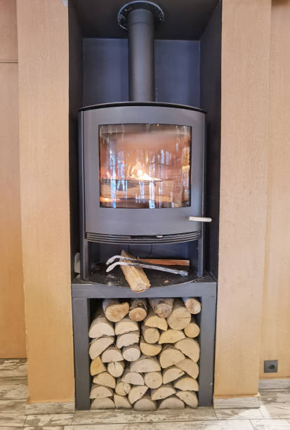 istock stove woods  chopped in pile and fire 1357238453