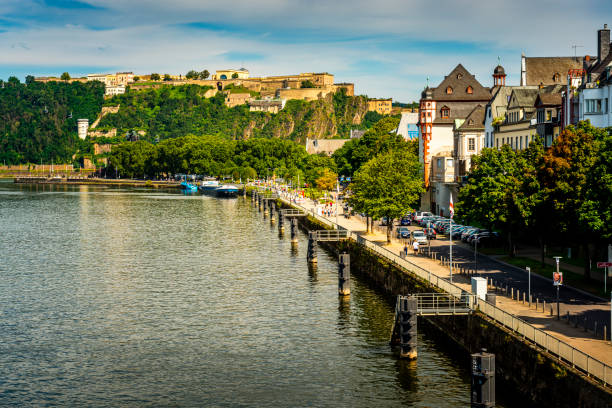 Koblenz, Germany - August 11, 2021: View over the promenade at riverside in Koblenz. In back on a hill is the famous fortress Ehrenbreitstein