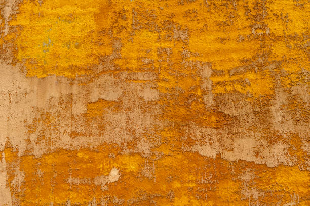 コピースペース用の黄色とオレンジの粗いテクスチャーの背景 - orange wall textured paint ストックフォトと画像
