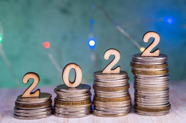 Banner 2022. Coins and Figures 2022. Money stacked in columns. stock photo