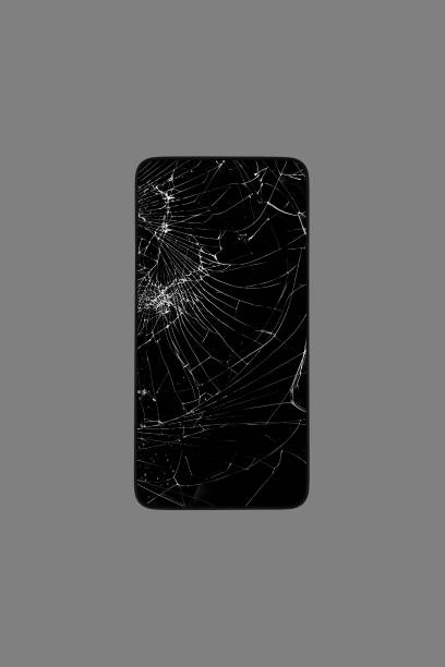 istock smartphone with a broken screen isolated on a gray background top view 1357244711