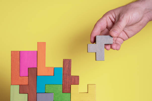 istock Abstract construction from wooden blocks. Concept of decision making process 1357247418