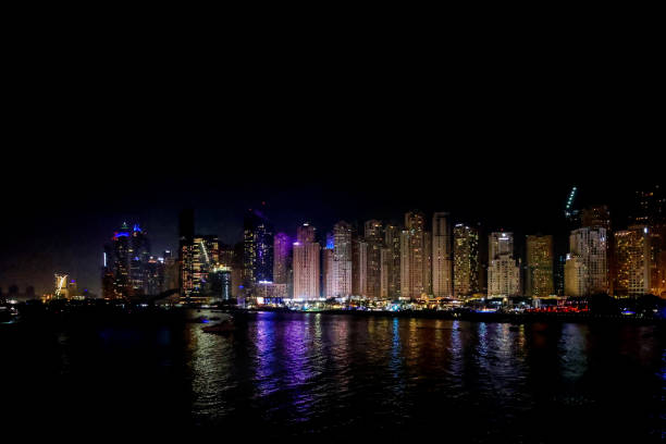 istock Panoramic view at night of Business Bay district with reflection in sea, UAE. Aerial sky at highest buildings in central Dubai, United Arab Emirates 1357248607