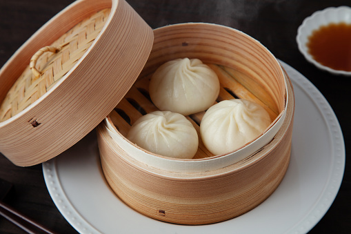 xiaolongbao Chinese steamed bun mantou dumpling on wooden table