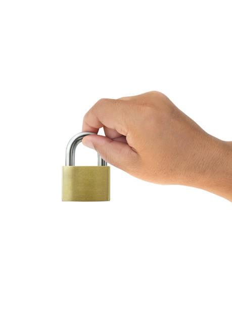 istock Hand holding metal padlock on white background 1357252342