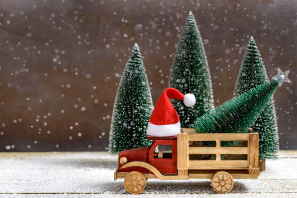 istock Toy truck with Christmas fir tree 1357253190