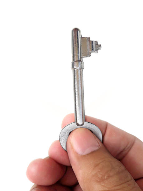 istock Human hand holding house key 1357253944