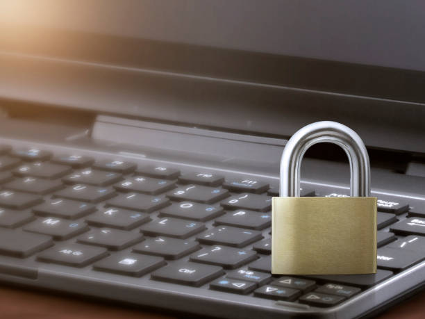 istock Computer security concept. Unlocked padlock on laptop keyboard. Symbol of safe. Toned soft focus picture 1357254041