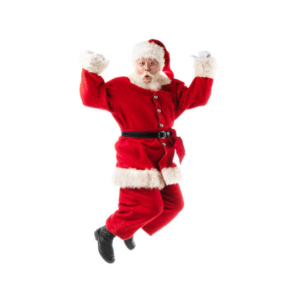 Santa Claus jumping isolated on white stock photo
