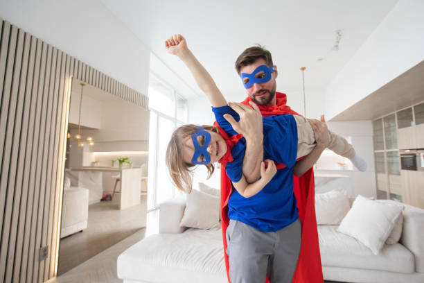 istock Father and son play superhero 1357255786