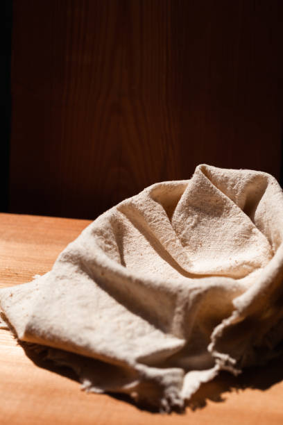 istock Cotton napkins on wooden table.towel 1357256752