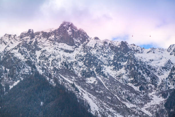 Chamonix Mont Blanc, France winter mountain ski travel vacation background. Cable car tram cabin, high snow mountain peaks in French Alps