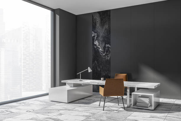 istock Corner view on dark office room interior with desk, armchairs 1357261313