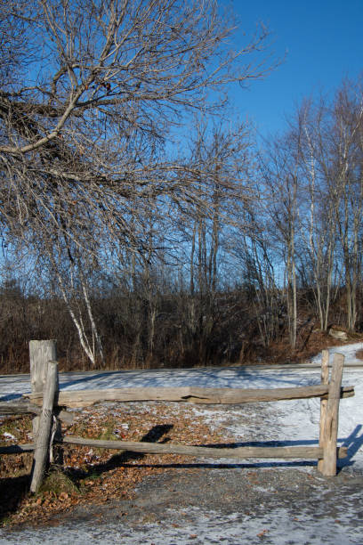 istock Old wooden fence in a field 1357261513