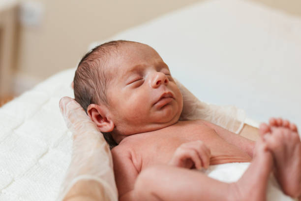 istock Physiotherapist doing a cervical evaluation on a newborn baby. 1357262565