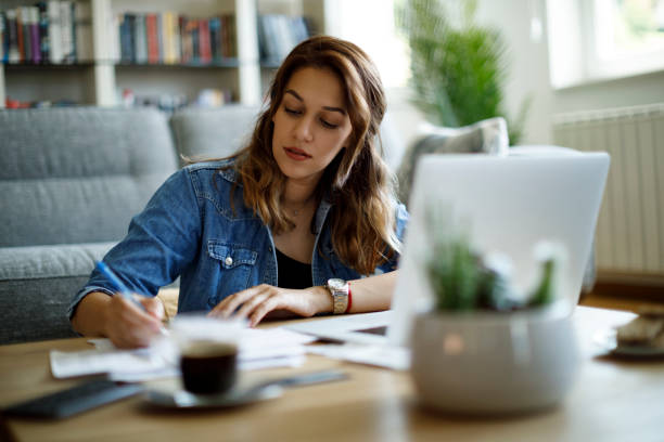 istock Young woman working at home 1357265438