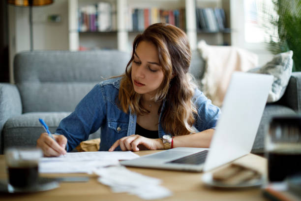 istock Young woman working at home 1357265455