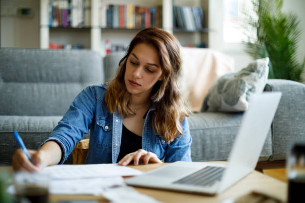 istock Young woman working at home 1357265468