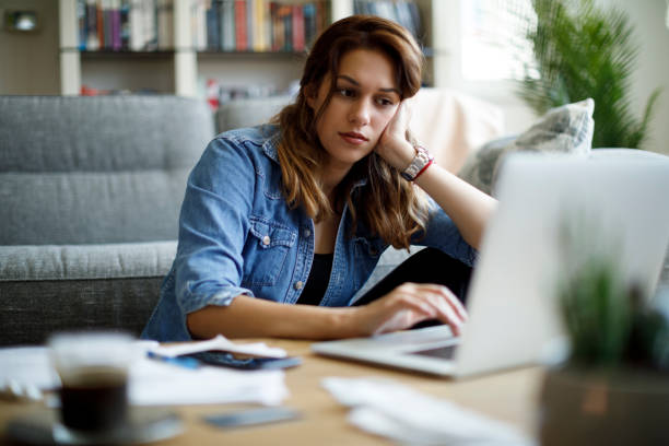 istock Worried woman working at home 1357265514