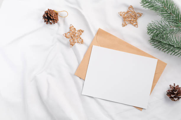 istock Christmas craft envelope and white card mockup on textile 1357265522