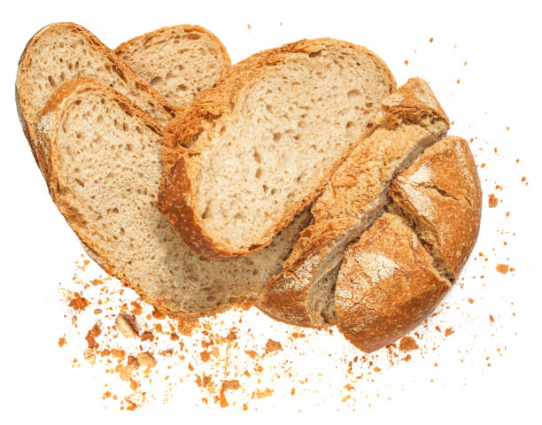 istock Freshly baked Bread with crumbs  isolated on white background.  Sliced, cutted wheat bread. 1357265637