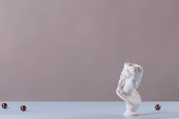 istock Plaster busts of young woman on grey background 1357266871