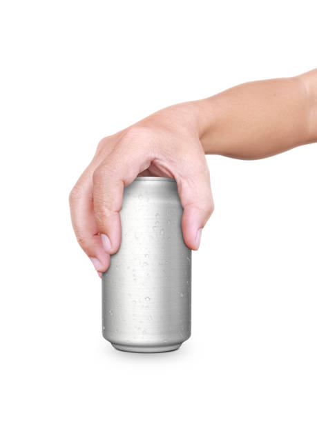 istock Man holding aluminum can isolated on white background 1357267031